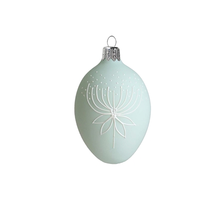 Easter egg with flower decoration in pastel green