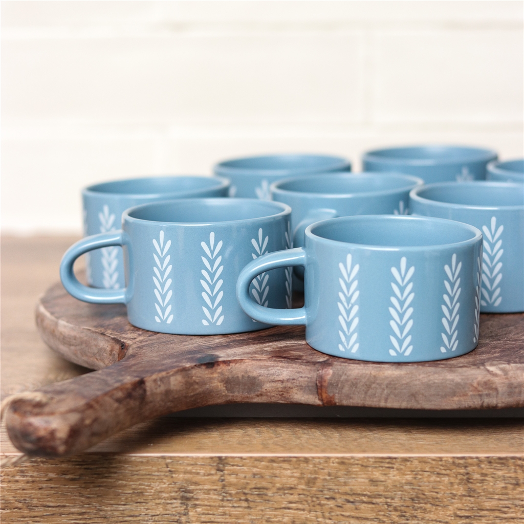 Blue mug with leaf decoration