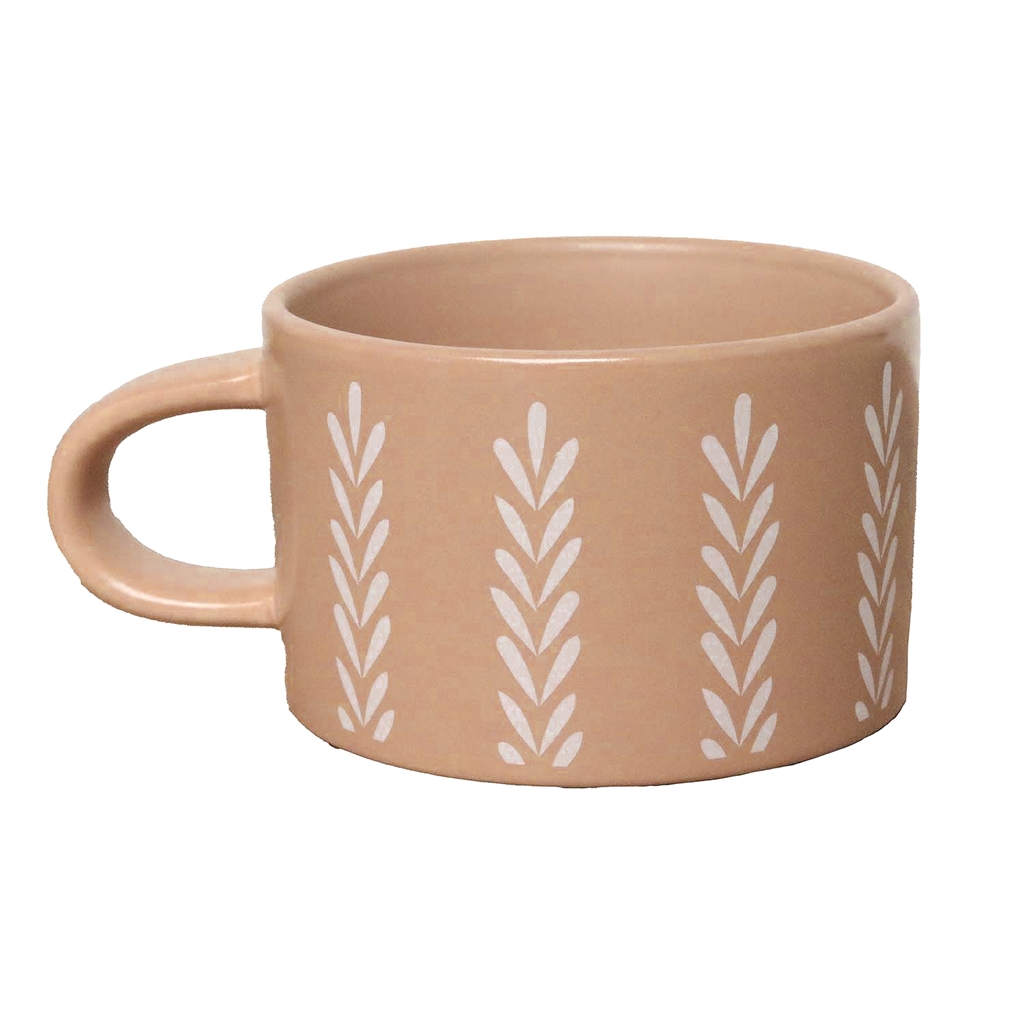 Brown mug with leaf decoration