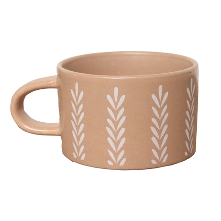 Brown mug with leaf decoration
