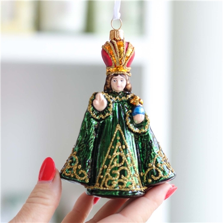 Baby Jesus in a green robe 