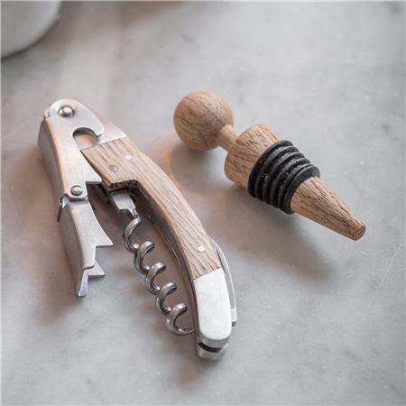 Set of a wine opener and corks made of oak