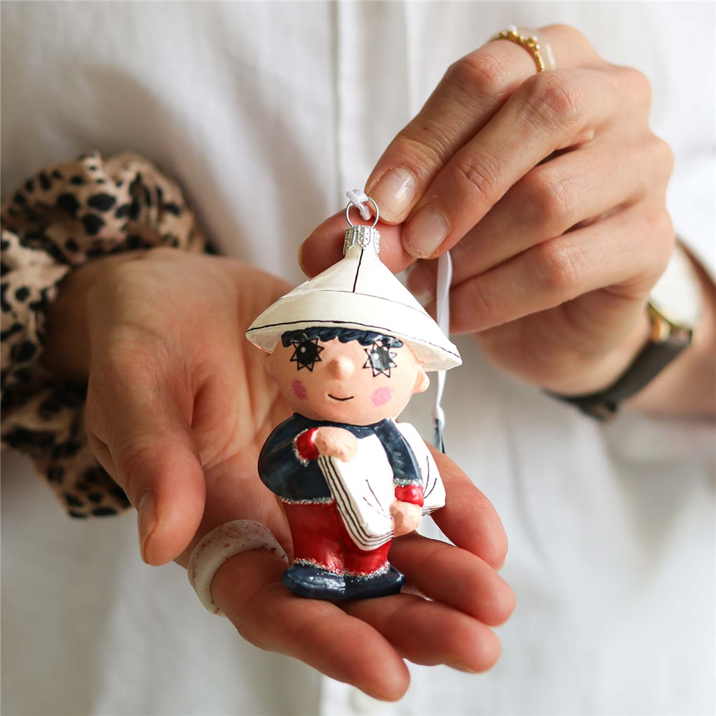 Evening Star figurine with newspaper