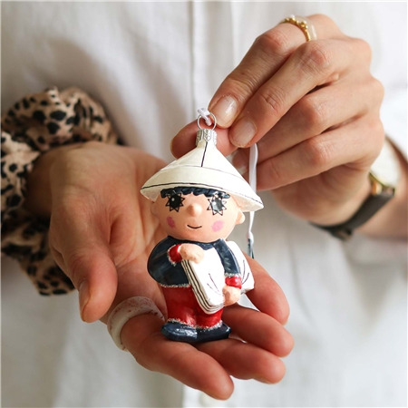 Evening Star figurine with newspaper