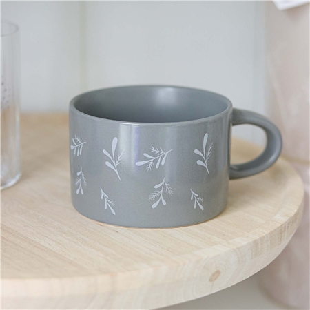 Gray mug with falling twigs