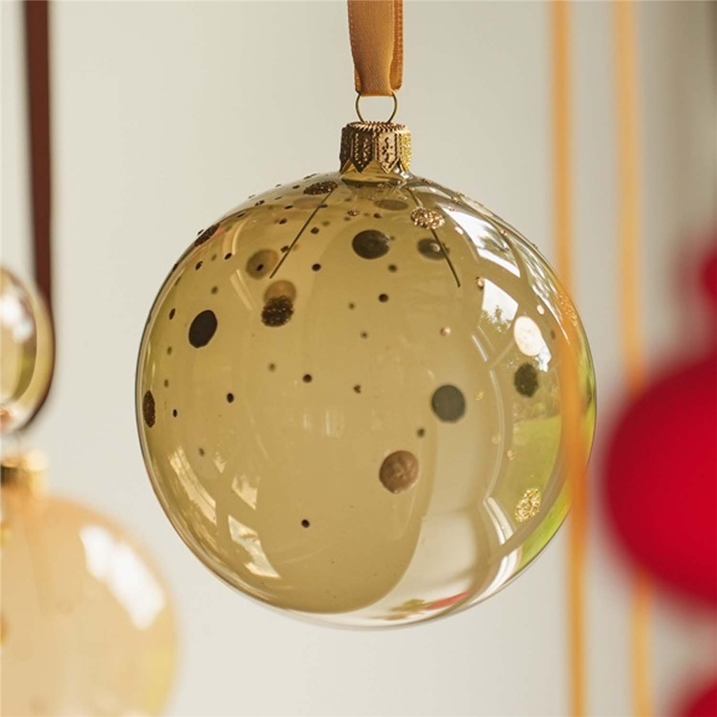 Glass clear ornament in olive green color with gold polka dots decor